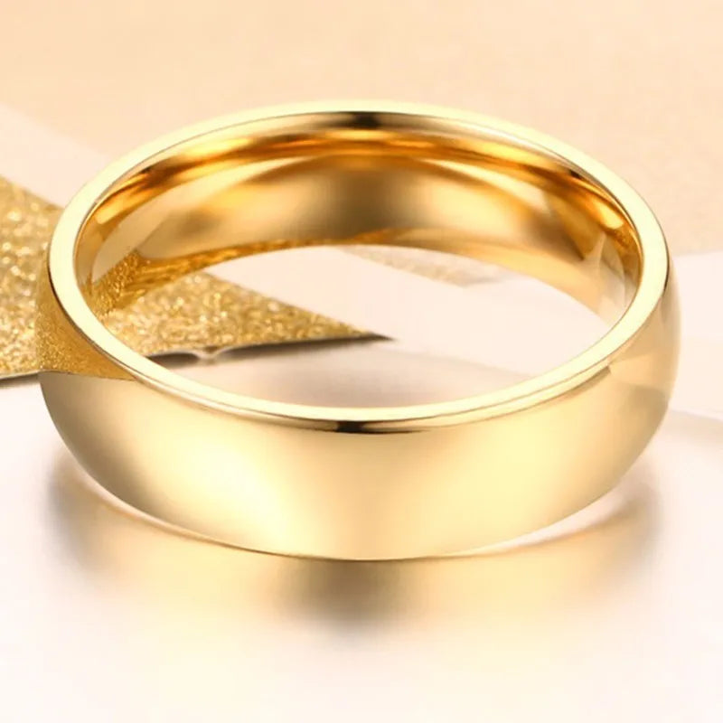 خاتم زفاف وخطوبة من الفولاذ المقاوم للصدأ بلون ذهبي، مناسب للنساء والرجال، متوفر بمقاسات أمريكية من 4 إلى 15. شحن مجاني.