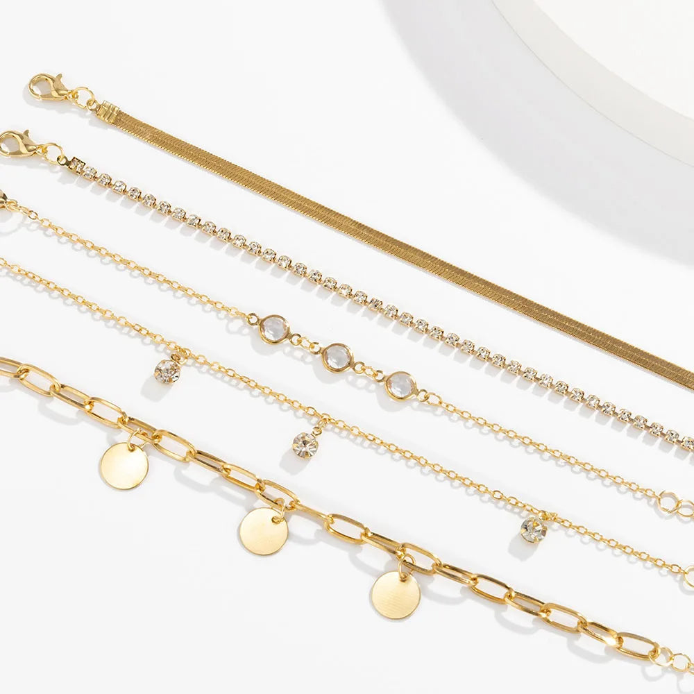 طقم أساور بتصميم بوهيمي أنيق، مزين بسلسلة على شكل عظمة ثعبان وقلادة مرصعة بأحجار الراين والترتر، بتصميم هندسي عصري، مناسب للفتيات.