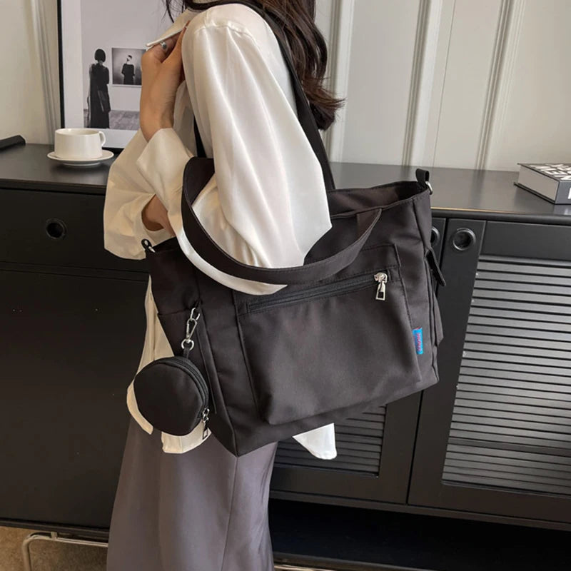 حقيبة كتف نسائية كبيرة الحجم للجنسين مع جيب للعملات المعدنية، حقيبة مدرسية للطلاب، حقيبة كاجوال، حقيبة كتف كروس بودي