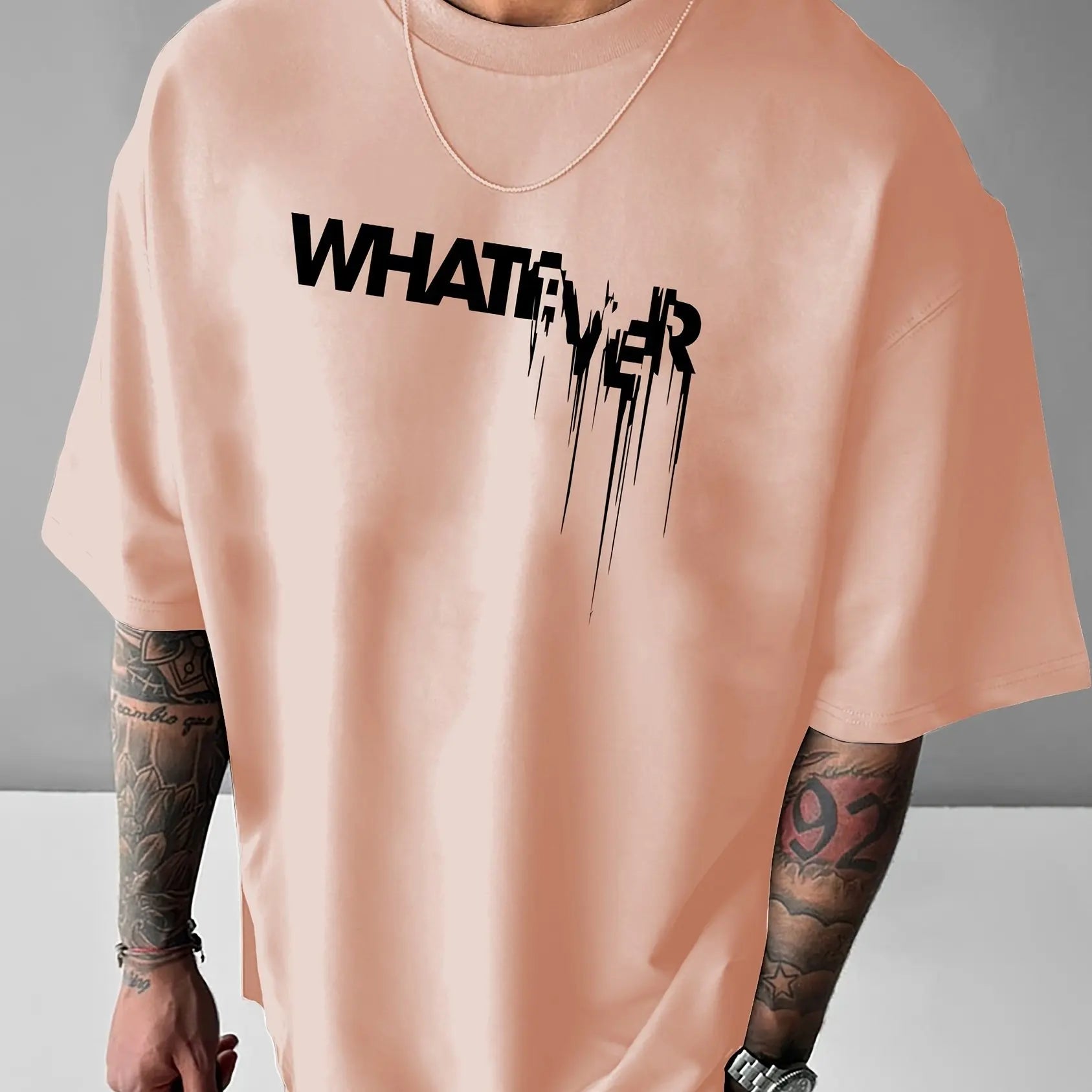 تيشيرت رجالي صيفي فضفاض مصنوع من القطن الخالص 100%، مطبوع عليه حروف WHATEVER، مريح وعملي، بياقة دائرية وأكمام قصيرة.