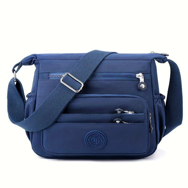 حقيبة كروسبودي أنيقة وخفيفة الوزن من النايلون للنساء، مزودة بحزام قابل للتعديل وتصميم متعدد الجيوب للسفر والتسوق والمواعيد والمدرسة