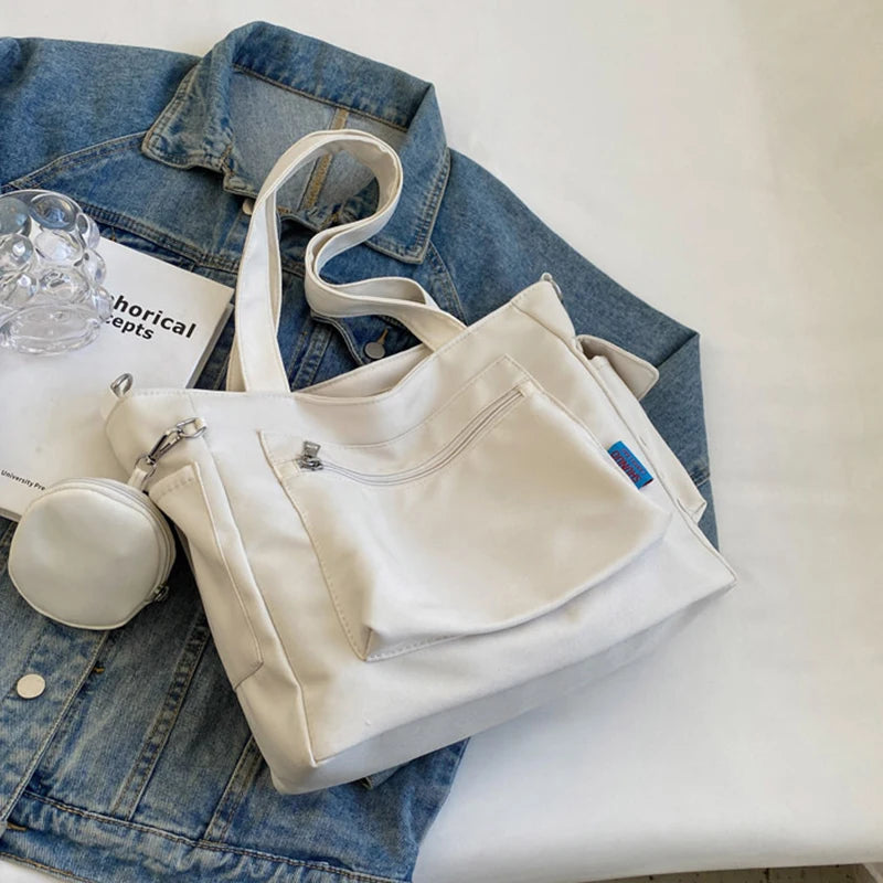 حقيبة كتف نسائية كبيرة الحجم للجنسين مع جيب للعملات المعدنية، حقيبة مدرسية للطلاب، حقيبة كاجوال، حقيبة كتف كروس بودي