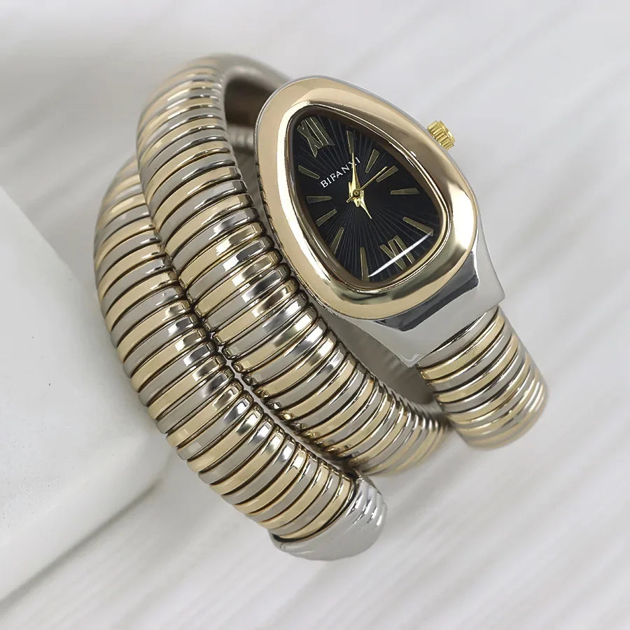 ساعات كوارتز فريدة من نوعها للنساء من الذهب الثعباني رائجة البيع ساعة بسيطة كلاسيكية الطراز للنساء ساعة فاخرة لامعة للسيدات ساعة Relogio