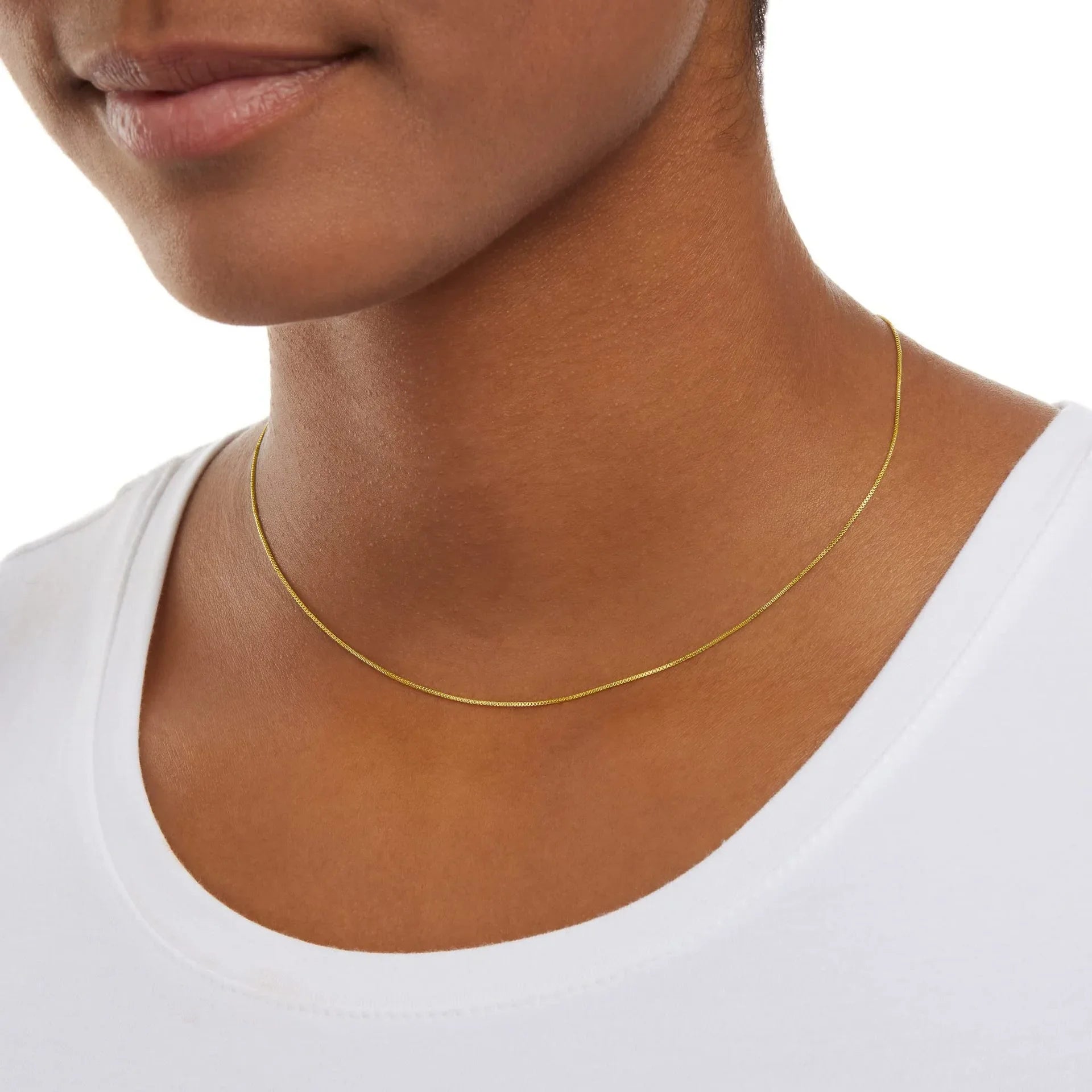 Delicate and timeless, this 925 sterling silver necklace features a sleek 1mm box chain finished in a rich gold plating. Its clean, minimalist design makes it the perfect foundation piece—lightweight yet durable, with a smo
