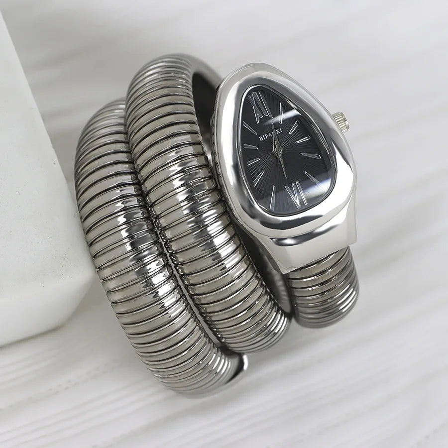 ساعات كوارتز فريدة من نوعها للنساء من الذهب الثعباني رائجة البيع ساعة بسيطة كلاسيكية الطراز للنساء ساعة فاخرة لامعة للسيدات ساعة Relogio