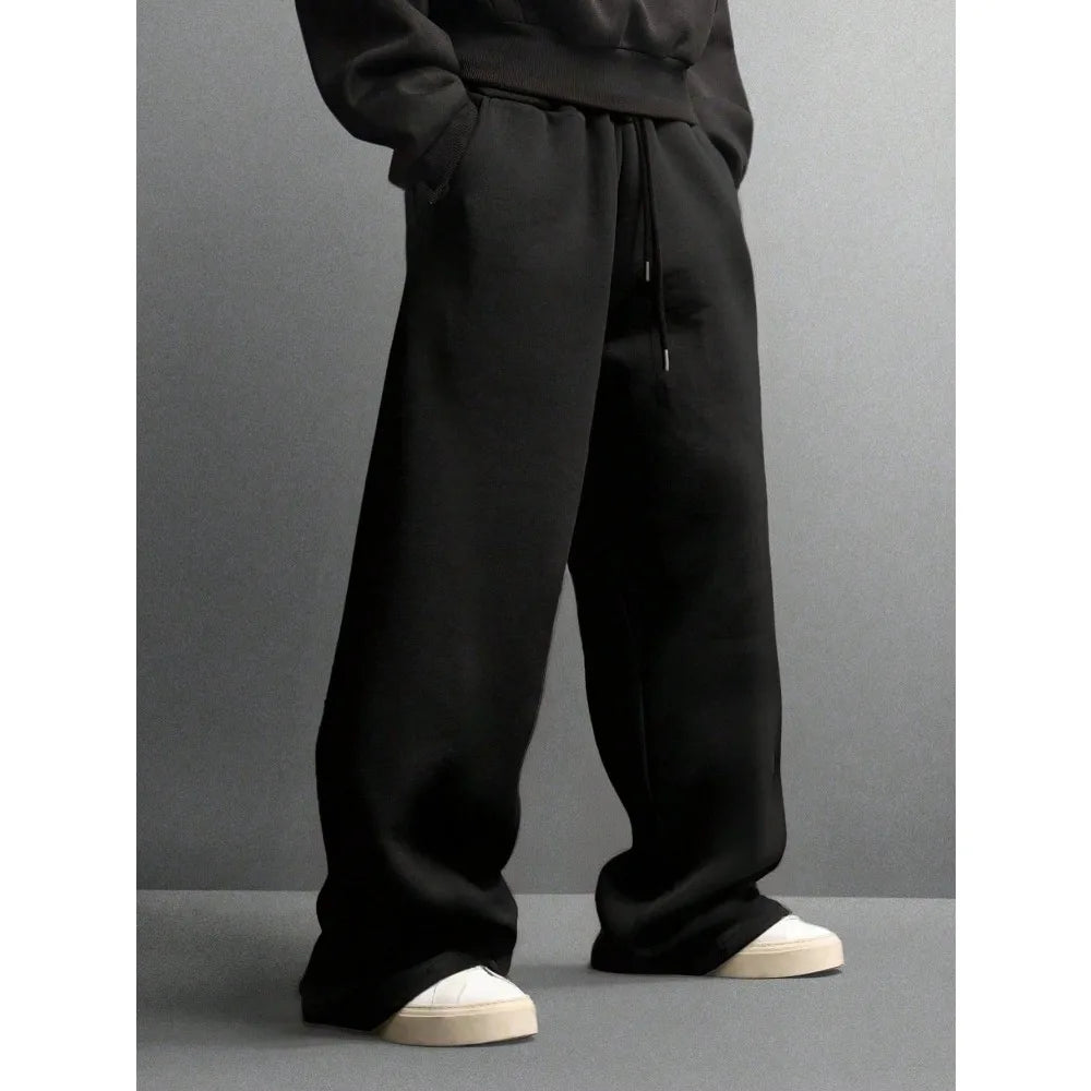Men's loose wide-leg pants solid color drawstring casual style long sports pants for autumn and winter wear. men clothing