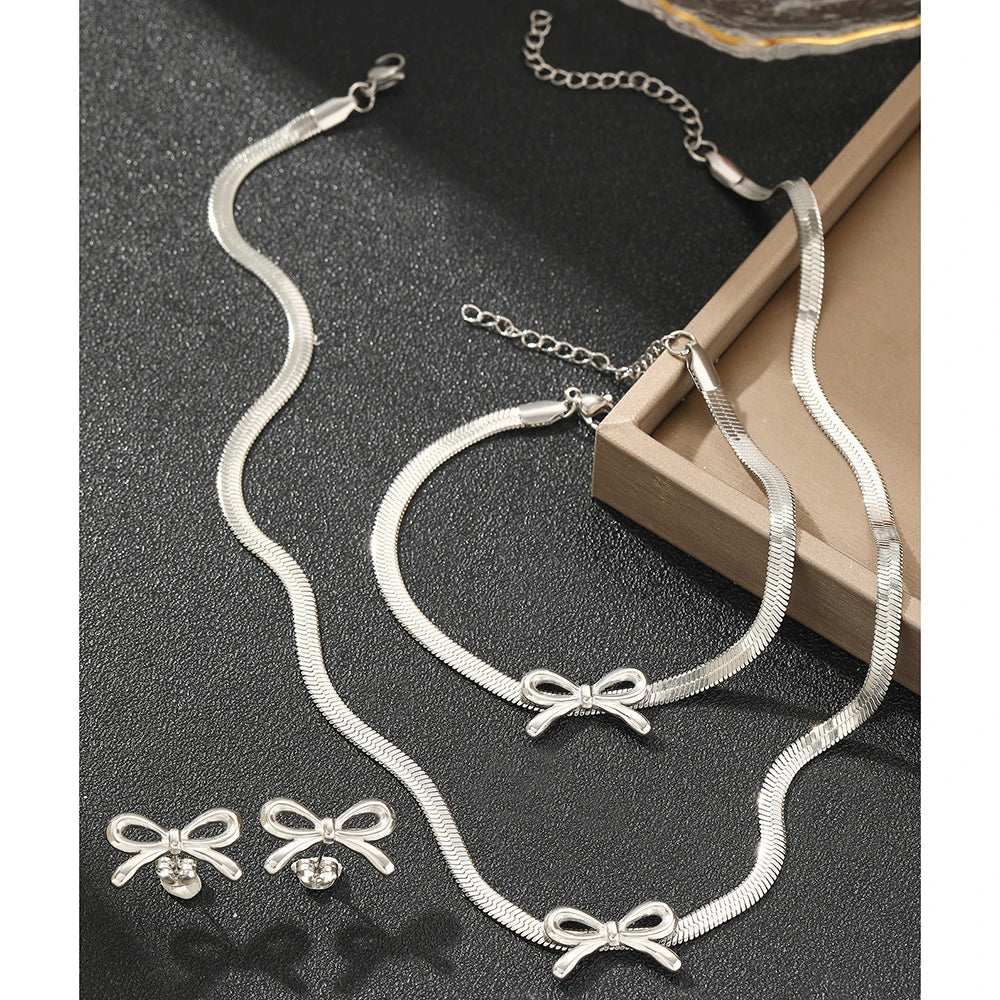 طقم مجوهرات من الفولاذ المقاوم للصدأ من وويوي، يتكون من 3 قطع: سوار، قلادة، وأقراط، وسلسلة، بتصميم فيونكة، هدية مثالية للنساء.