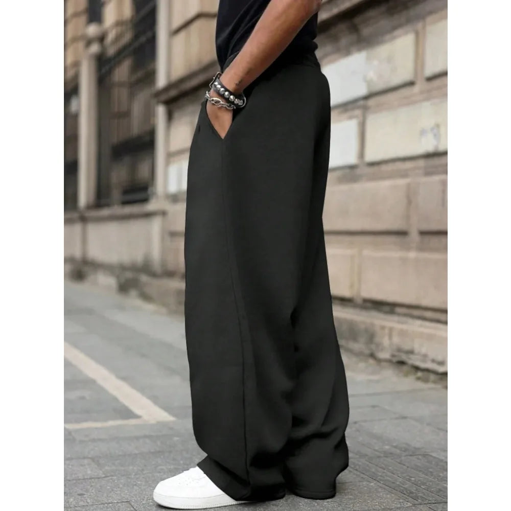Men's loose wide-leg pants solid color drawstring casual style long sports pants for autumn and winter wear. men clothing