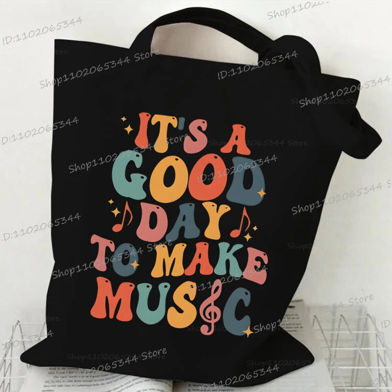 حقيبة يد كلاسيكية بطبعة نوتات موسيقية من الثمانينيات، وحقيبة قماشية مطبوعة بقلم رصاص، وحقيبة كتف لمحبي الموسيقى القديمة، وحقيبة مدرسية