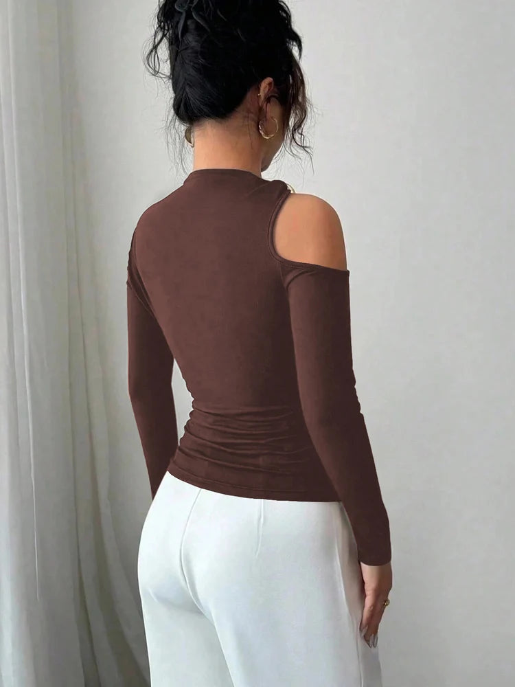 تي شيرت نسائي من كريسسين بكتف مكشوف وأكمام طويلة ومشبك معدني وقميص ضيق ومجوف منقوش منقوش بلوزة خريفية مناسبة للشارع تناسب نمط الحياة في سن 20 عامًا