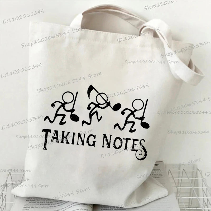 حقيبة يد كلاسيكية بطبعة نوتات موسيقية من الثمانينيات، وحقيبة قماشية مطبوعة بقلم رصاص، وحقيبة كتف لمحبي الموسيقى القديمة، وحقيبة مدرسية