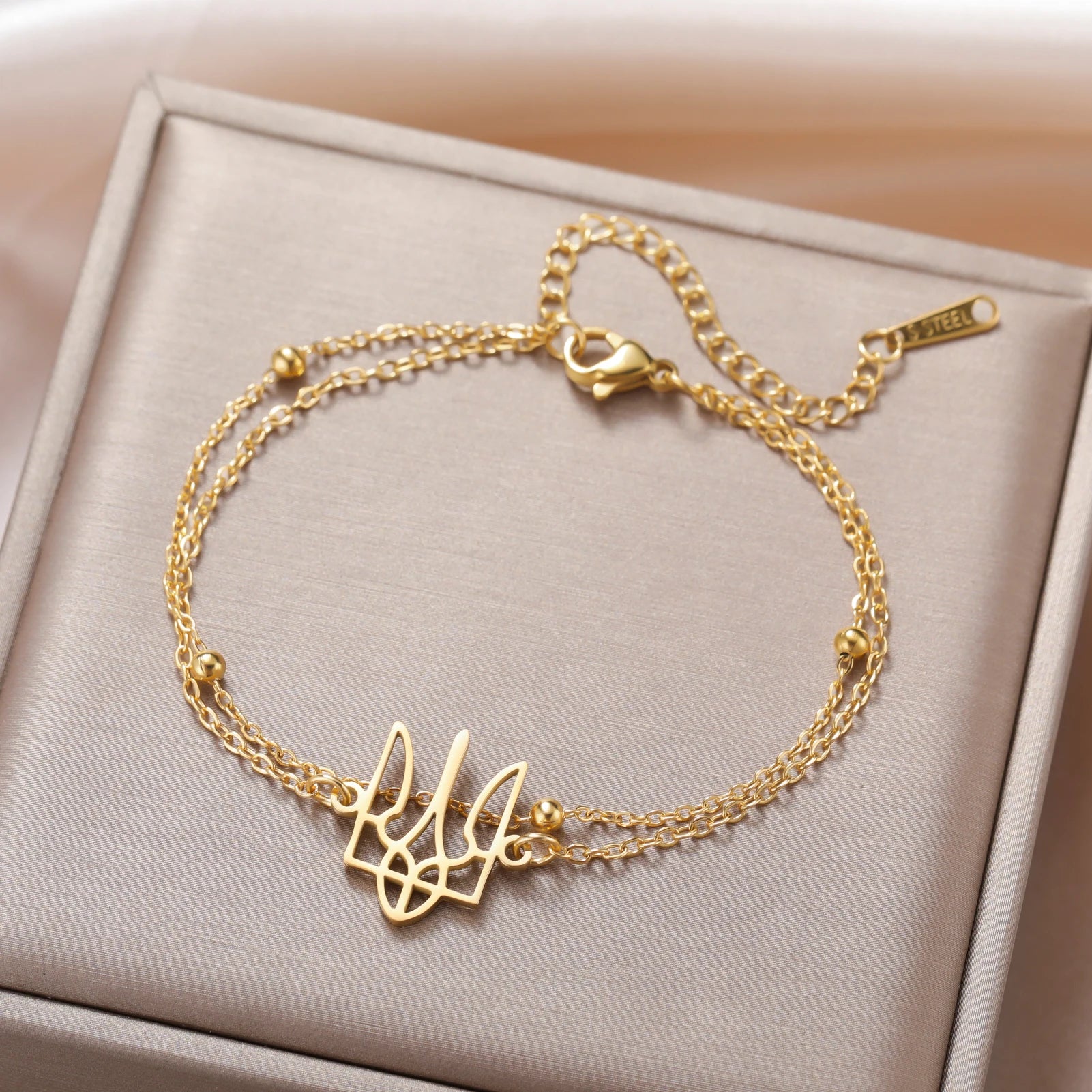 أساور كازادور، رمز أوكرانيا الوطني، للنساء والرجال، مصنوعة من الفولاذ المقاوم للصدأ، مزينة بخرز وسلسلة، تُعدّ هدية مثالية من المجوهرات الأوكرانية.