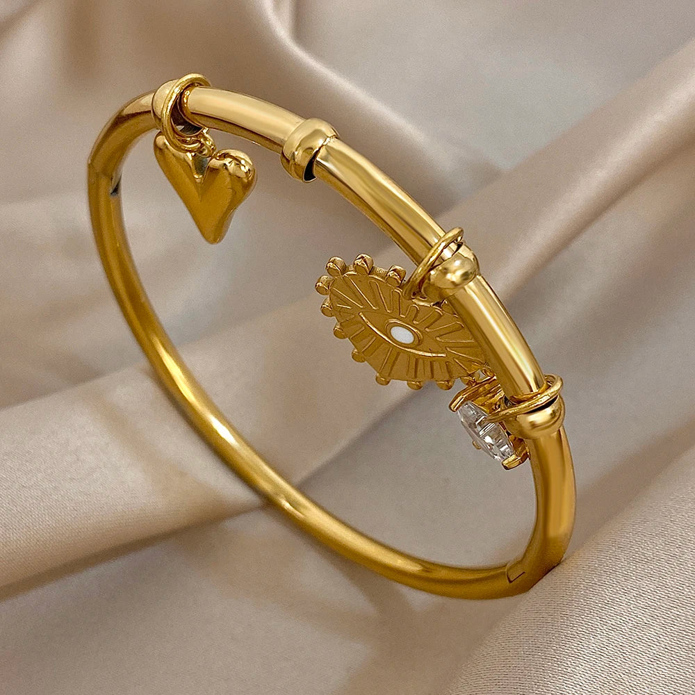 سوار أنيق من الفولاذ المقاوم للصدأ للنساء مطلي بالذهب على شكل قلب من الزركون وعين الشيطان مع أساور مجوهرات هدايا