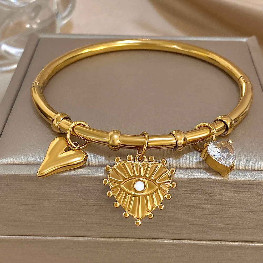 سوار أنيق من الفولاذ المقاوم للصدأ للنساء مطلي بالذهب على شكل قلب من الزركون وعين الشيطان مع أساور مجوهرات هدايا