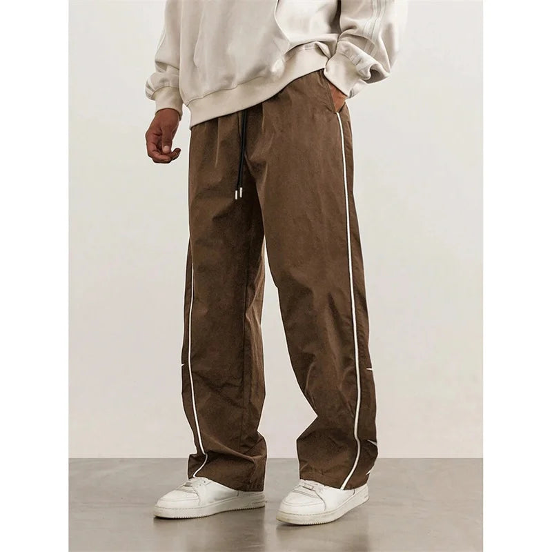 2025 Spring Autumn New Men’s pure color Casual Embroidered Drawstring Pants Men fashion Loose quick-drying Leg Straight Pants