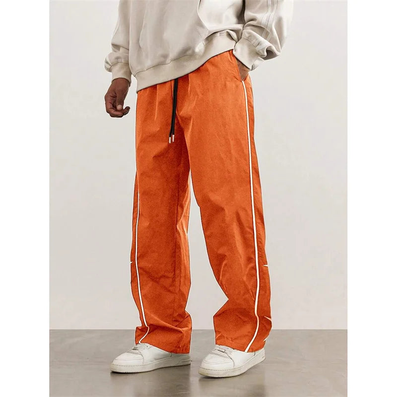 2025 Spring Autumn New Men’s pure color Casual Embroidered Drawstring Pants Men fashion Loose quick-drying Leg Straight Pants