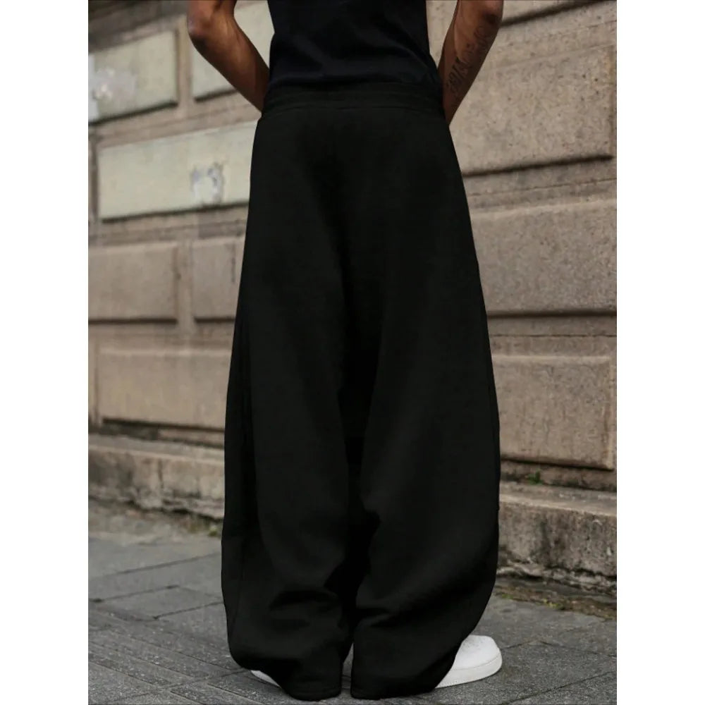 Men's loose wide-leg pants solid color drawstring casual style long sports pants for autumn and winter wear. men clothing