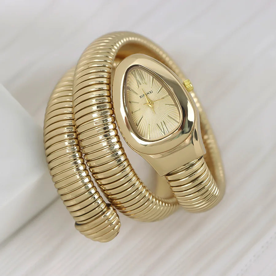 ساعات كوارتز فريدة من نوعها للنساء من الذهب الثعباني رائجة البيع ساعة بسيطة كلاسيكية الطراز للنساء ساعة فاخرة لامعة للسيدات ساعة Relogio