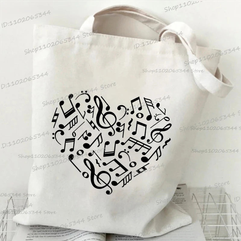 حقيبة يد كلاسيكية بطبعة نوتات موسيقية من الثمانينيات، وحقيبة قماشية مطبوعة بقلم رصاص، وحقيبة كتف لمحبي الموسيقى القديمة، وحقيبة مدرسية