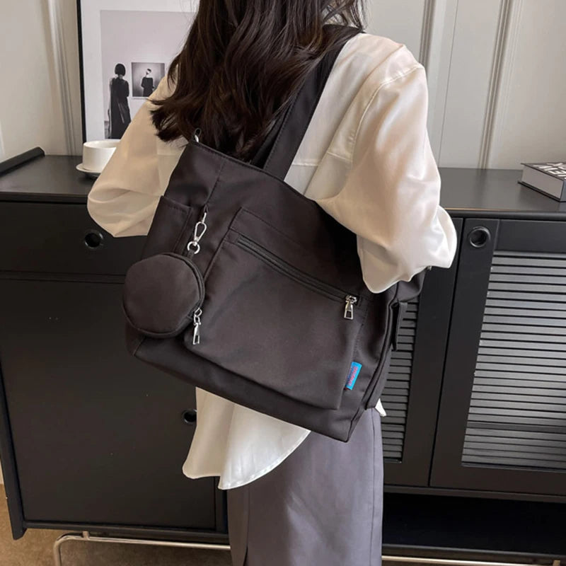 حقيبة كتف نسائية كبيرة الحجم للجنسين مع جيب للعملات المعدنية، حقيبة مدرسية للطلاب، حقيبة كاجوال، حقيبة كتف كروس بودي