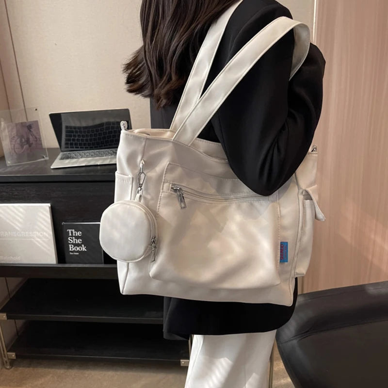 حقيبة كتف نسائية كبيرة الحجم للجنسين مع جيب للعملات المعدنية، حقيبة مدرسية للطلاب، حقيبة كاجوال، حقيبة كتف كروس بودي