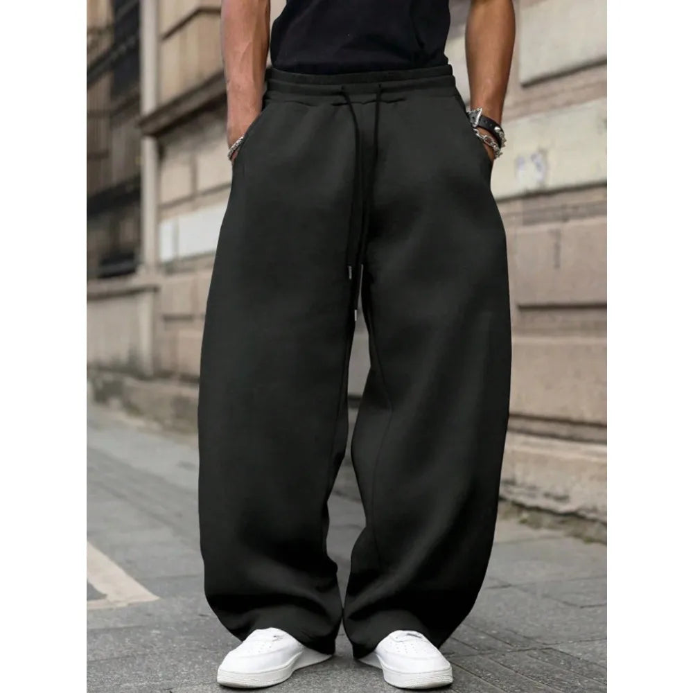 Men's loose wide-leg pants solid color drawstring casual style long sports pants for autumn and winter wear. men clothing