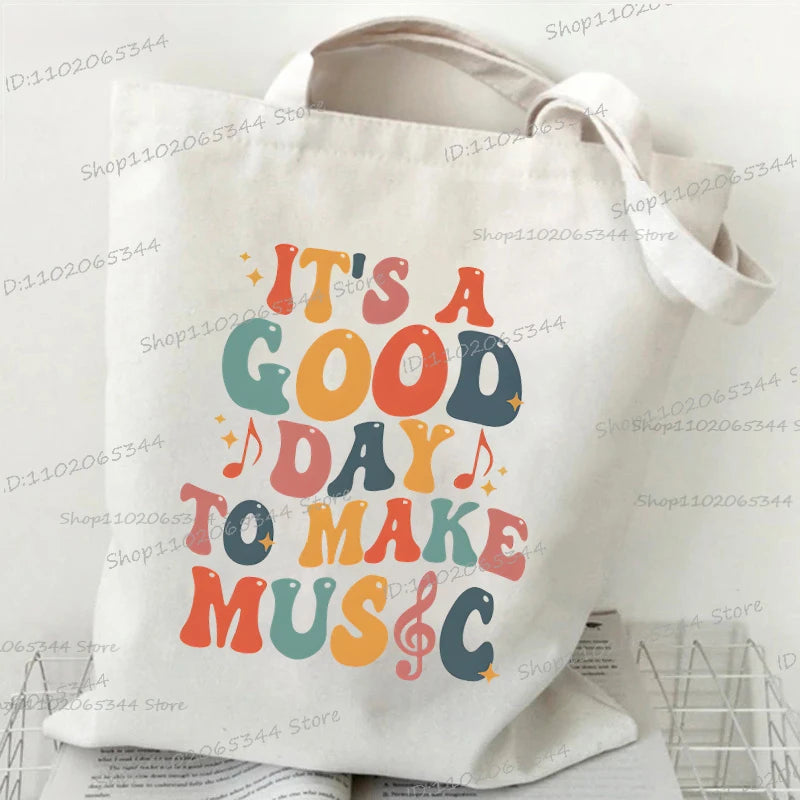 حقيبة يد كلاسيكية بطبعة نوتات موسيقية من الثمانينيات، وحقيبة قماشية مطبوعة بقلم رصاص، وحقيبة كتف لمحبي الموسيقى القديمة، وحقيبة مدرسية