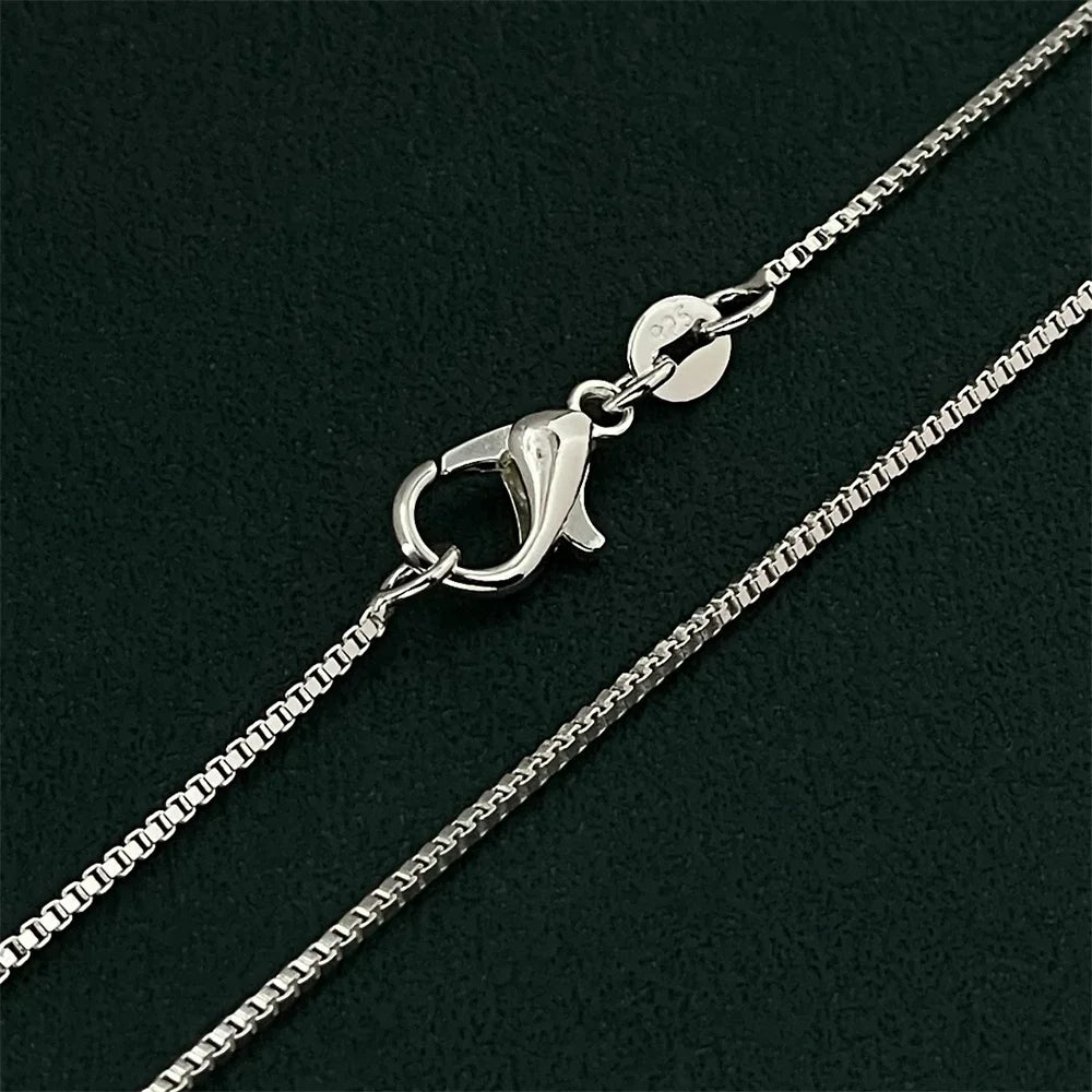 Delicate and timeless, this 925 sterling silver necklace features a sleek 1mm box chain finished in a rich gold plating. Its clean, minimalist design makes it the perfect foundation piece—lightweight yet durable, with a smo